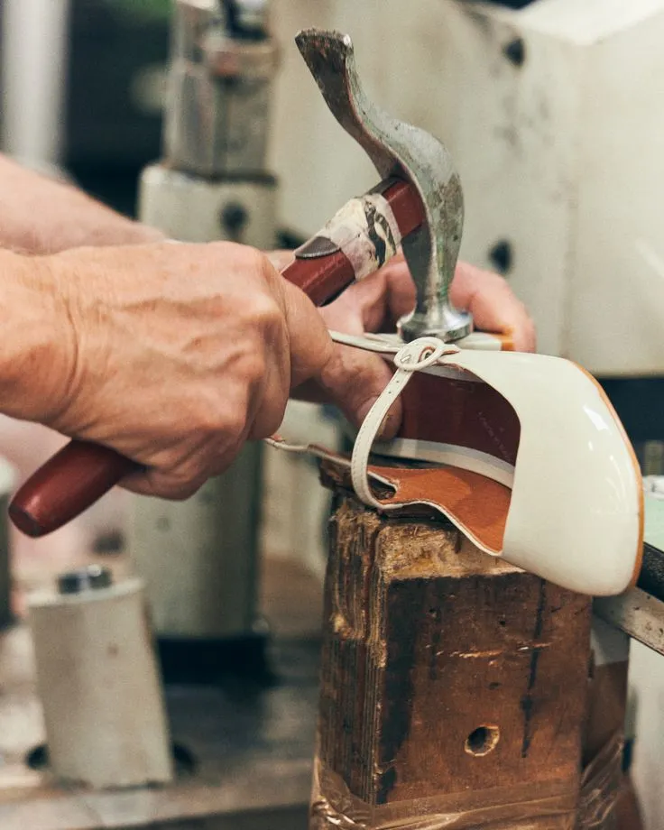 MARITZA craftsman hand-lasting a leather shoe on a wooden last - handmade genuine leather