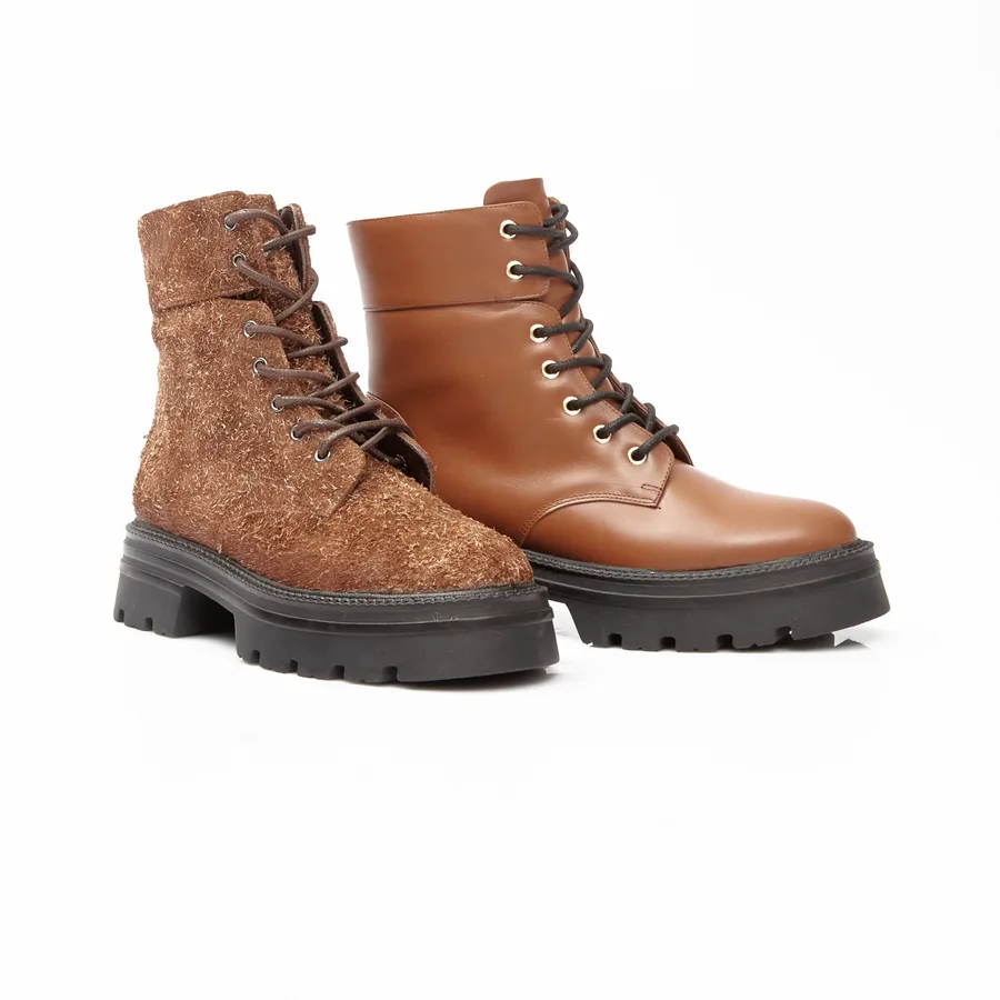 Two MARITZA lace-up boots side by side — one in rough-out suede, one in smooth tan calf leather, both on a lug sole
