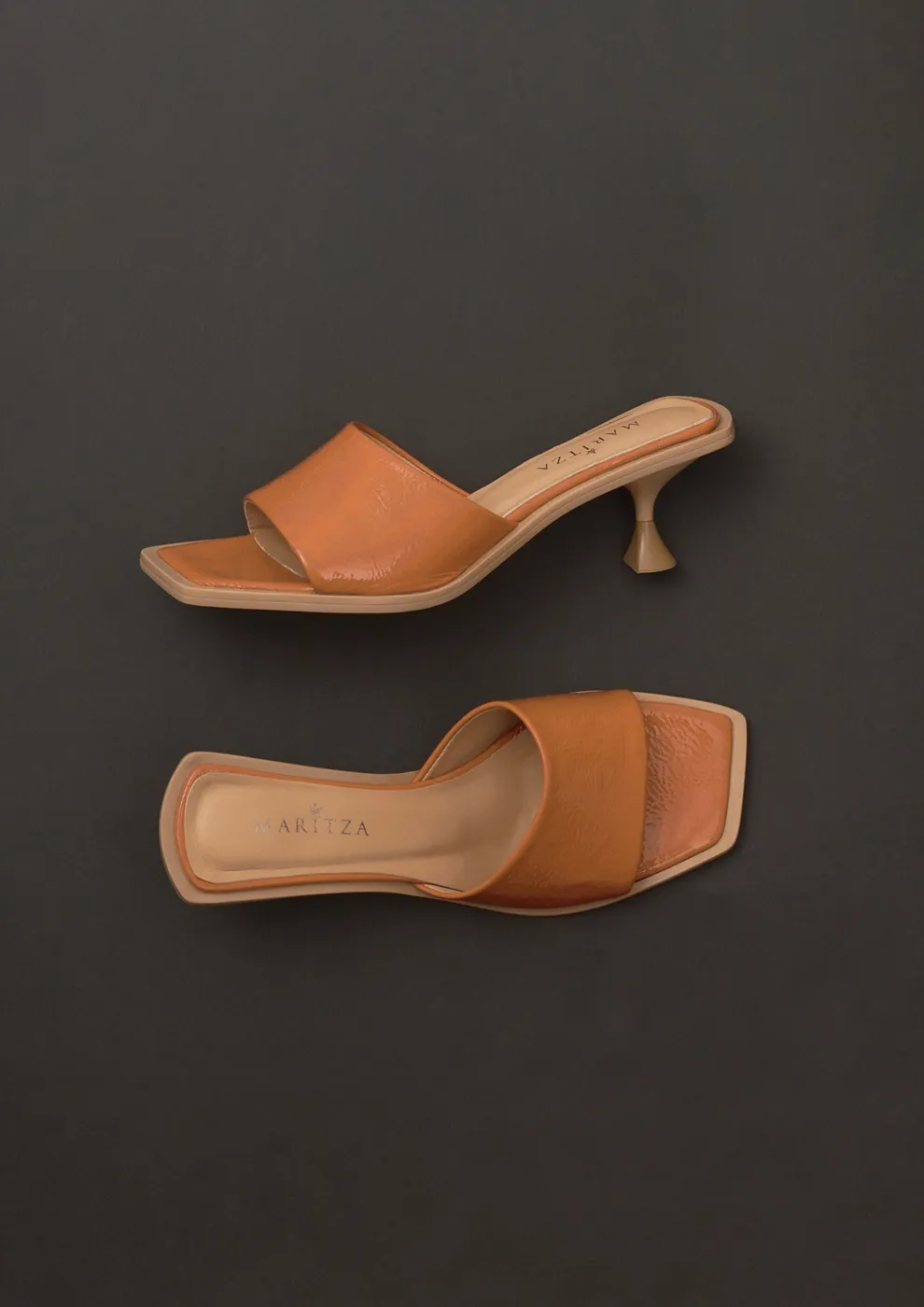 MARITZA tan leather mule with a square open toe on a sculpted spool kitten heel, shown from the side and above