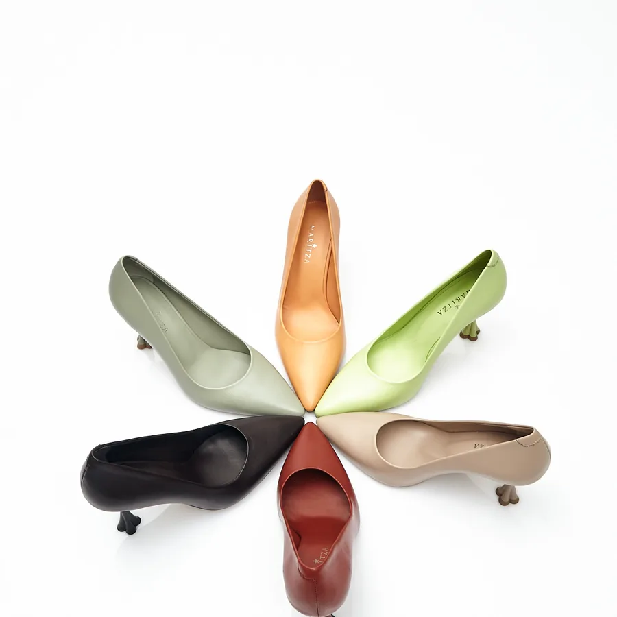 MARITZA SS24 catalog — six pointed-toe leather pumps in sage, apricot, lime, sand, oxblood and black, arranged in a fan
